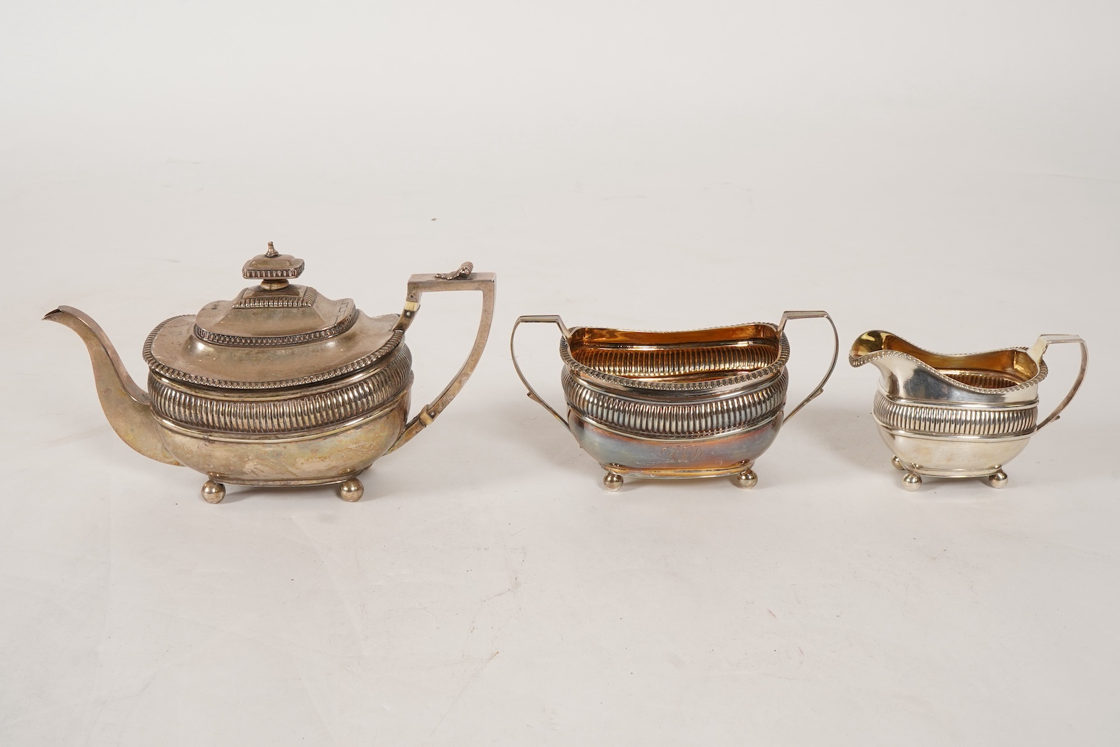 A George III silver three piece tea set, by John Wakefield